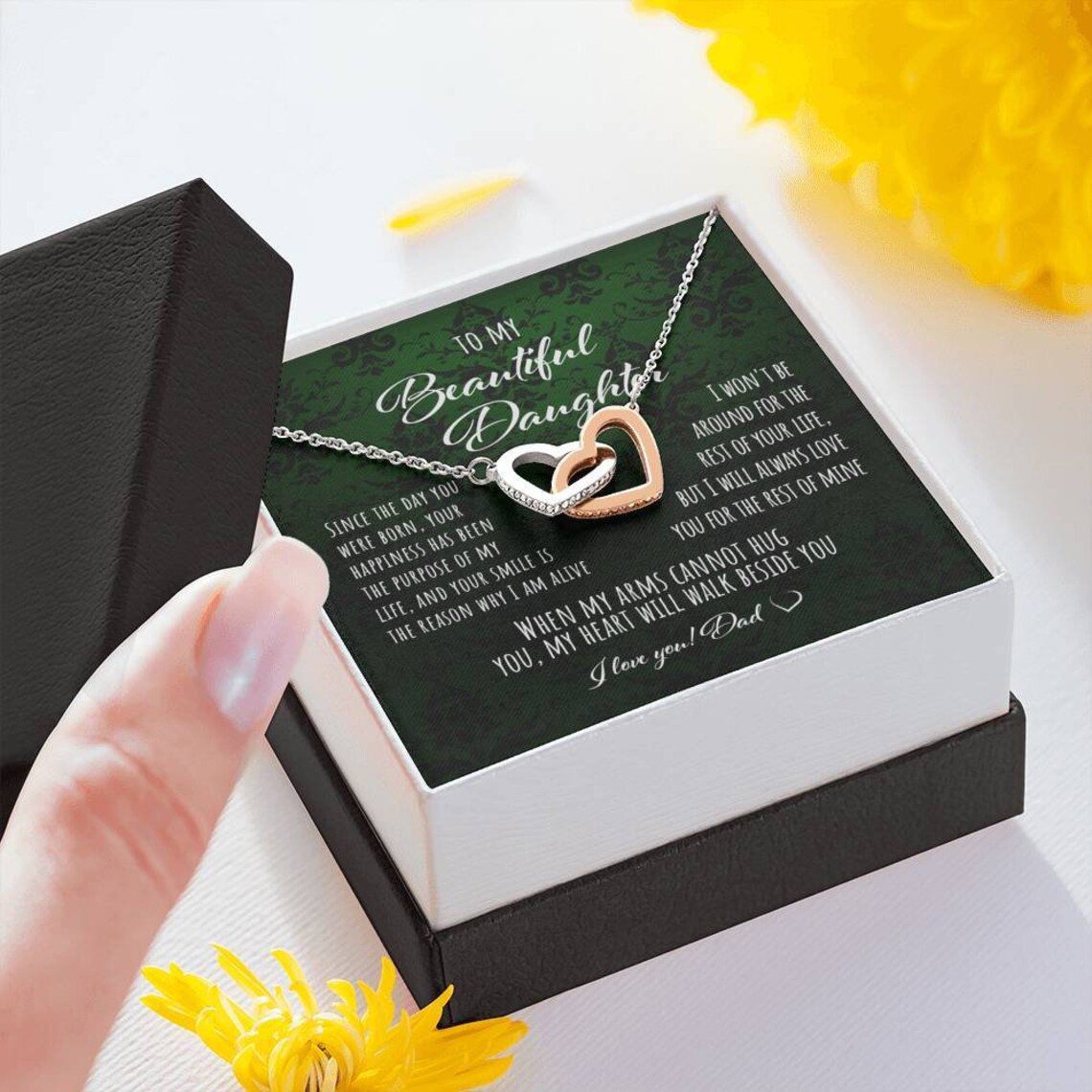 Interlocking hearts necklace in a two-toned gift box for daughter.